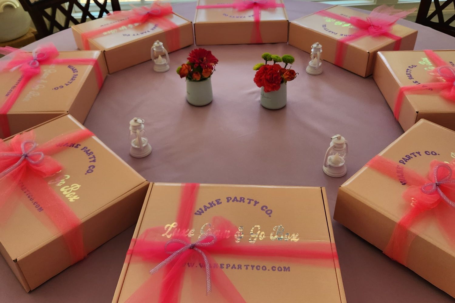 Luxe Grab & Go craft boxes tied with pink ribbon