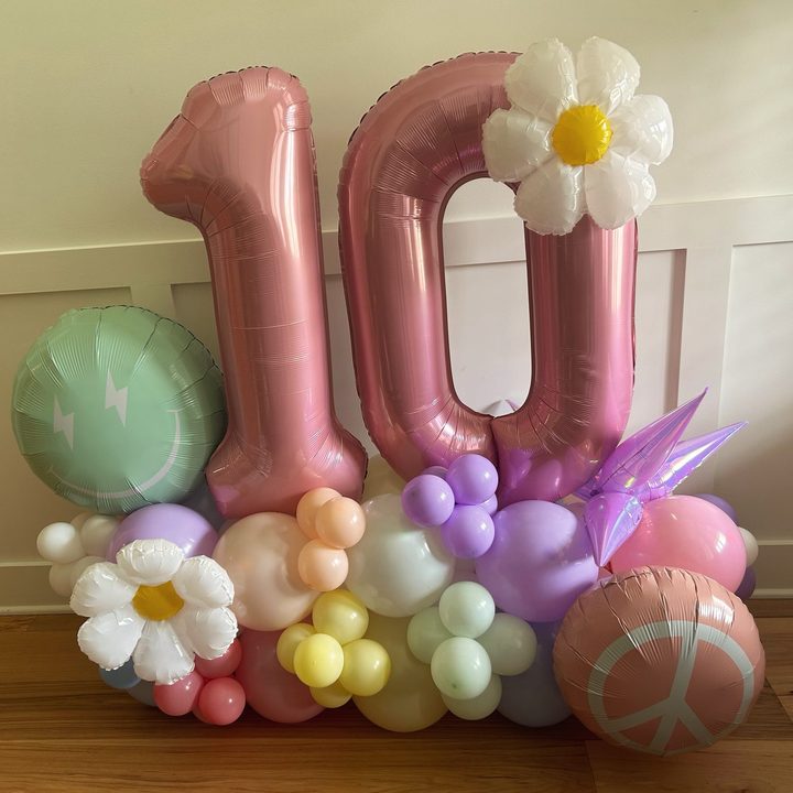 Pink number 10 balloon stack with daisy and pastel balloons in Raleigh, NC