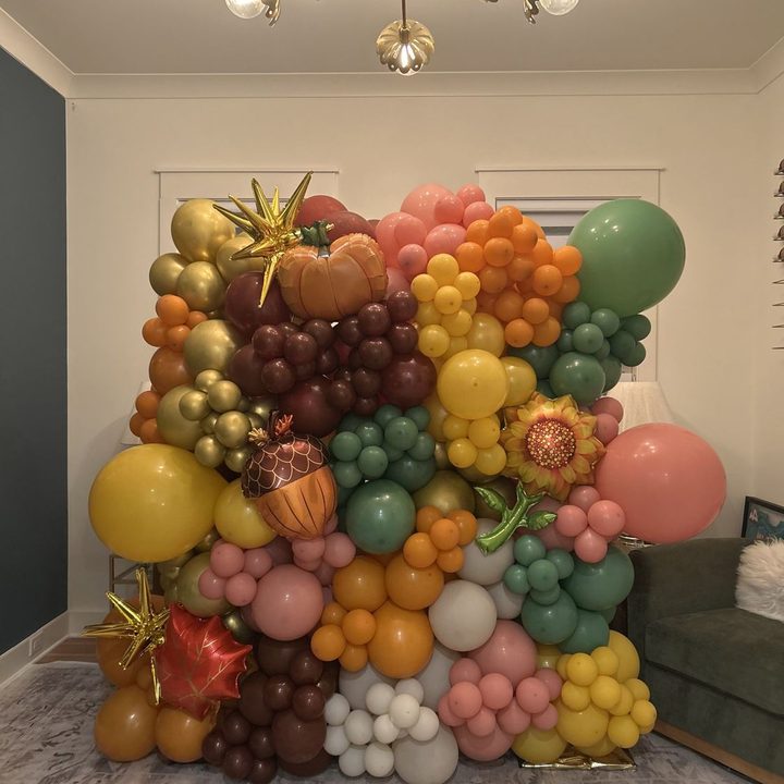 Fall balloon wall in orange, gold and sage in Raleigh, NC