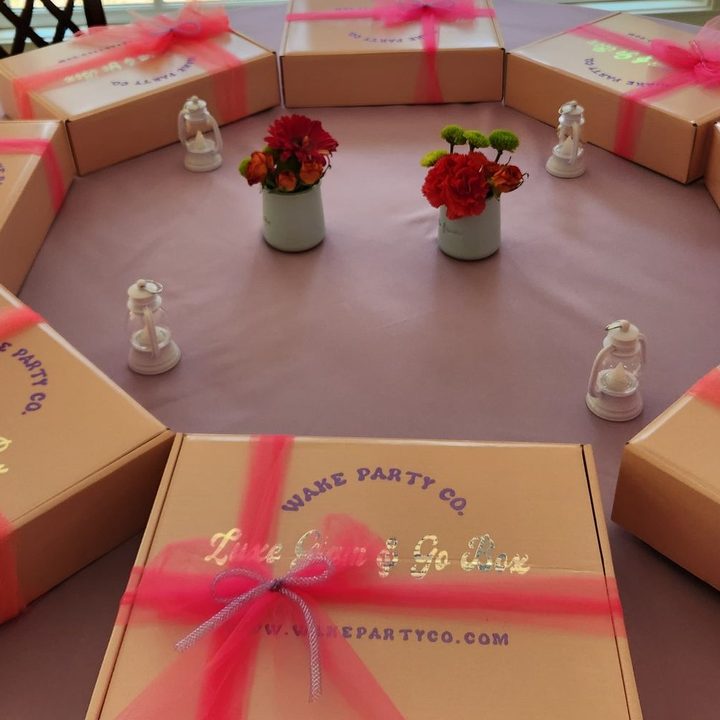 Luxe Glam & Go Boxes tied with pink ribbon, ready for each child