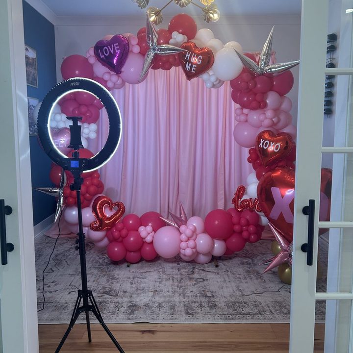 Picture Perfect Selfie Station ring light and phone holder with a Valentine balloon garland backdrop in Raleigh, NC
